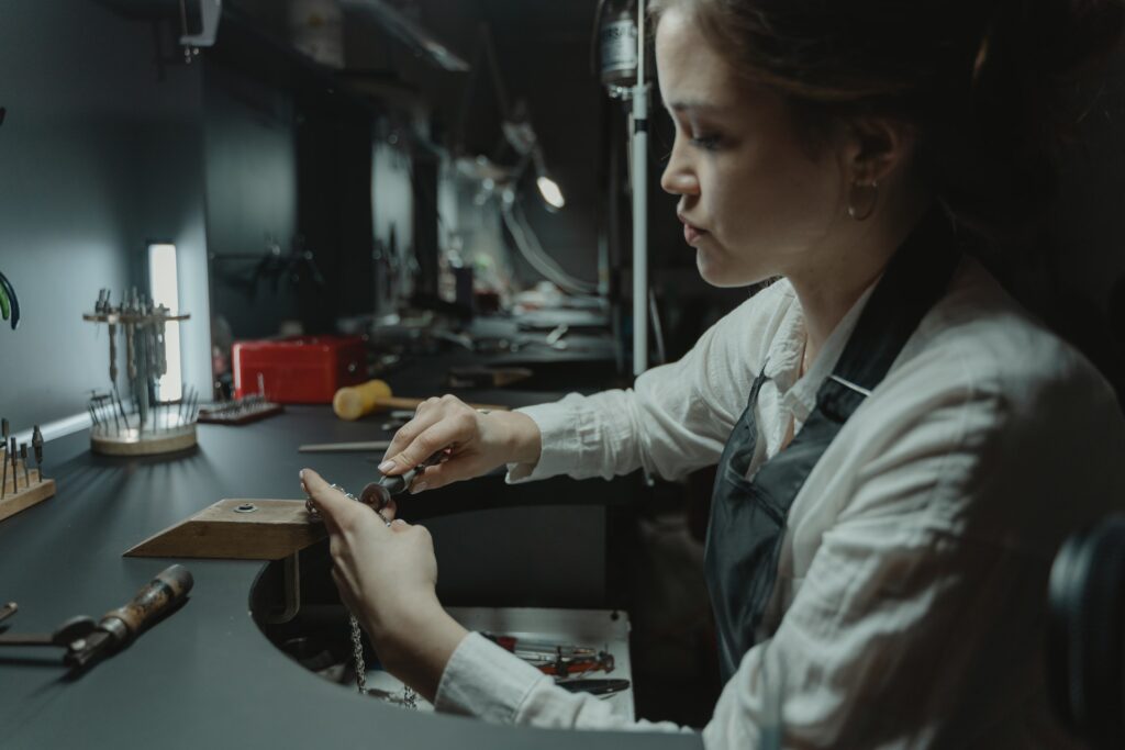 Girl polishing jewelry